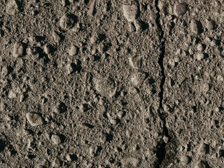 texture of dirty old asphalt with stones