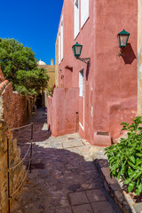 Traditional architecture with  narrow  stone street  in  the medieval  castle of Monemvasia, Lakonia, Peloponnese, Greece.