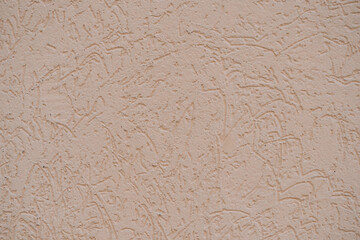 structure of wall covered with beige textured putty