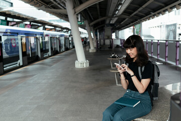 City backpacker waiting for a train.