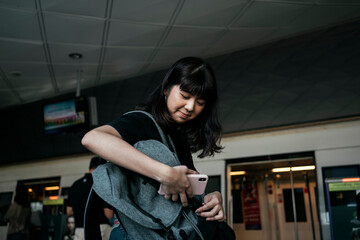 Woman travel by a train in Bangkok.