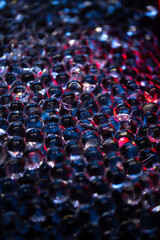 Background from small transparent hydrogel balls illuminated with blue and red light