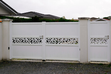 modern white gate of home aluminum portal with pedestrian outdoor door in suburbs house
