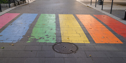 Pedestrian town street colours crossing marking in LGBT colourful rainbow lesbian gay flag in Bordeaux city France