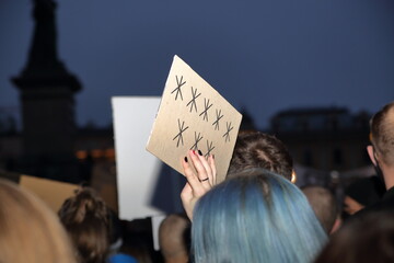 People demonstrate against Polish government and Law and Justice party, banner with 8 sars...