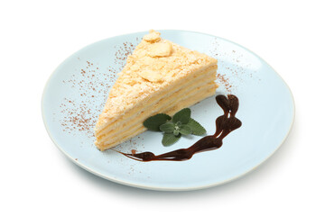 Plate with piece of Napoleon cake isolated on white background