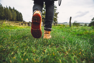 hiking boots on the grass