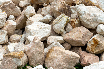Mountain stone used in the construction of various buildings and territories.