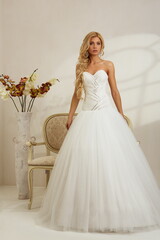 Fototapeta premium Bride in a luxury apartment in a wedding dress.