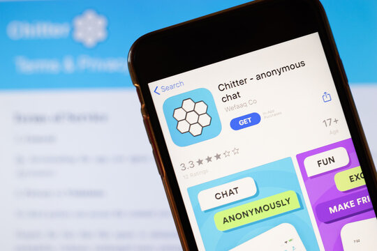 Los Angeles, California, USA - 24 March 2020: Chitter app logo on phone screen close up with website on background with icon, Illustrative Editorial