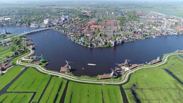 High altitude aerial view of Zaanse Schans is a neighbourhood of Zaandam near Amsterdam the Netherlands and is best known for its collection of well-preserved historic windmills and houses 4k quality