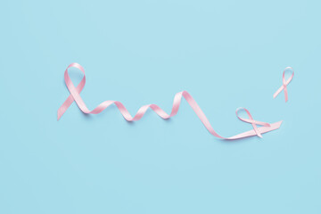 Pink ribbons on color background. Breast cancer awareness concept