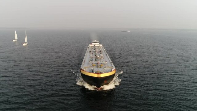 Low altitude aerial footage of tanker or tankship is a ship designed to transport or store liquids or gases in bulk these vessels also carry commodities such as vegetable oils molasses and wine 4k