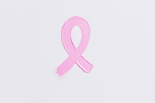 Painted pink ribbon on white background. Breast cancer awareness concept