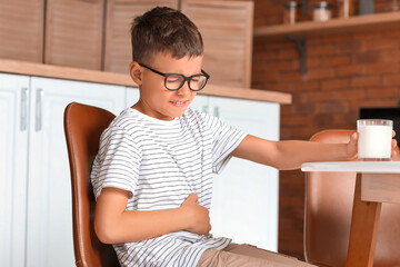 Little boy with dairy allergy in kitchen