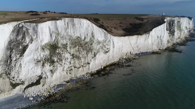 Aerial view of White Cliffs of Dover part of the North Downs formation is the region of English coastline facing the Strait and France and are a popular tourist destination 4k high resolution quality