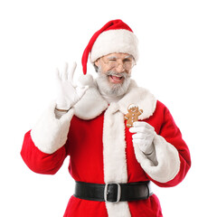 Santa Claus with tasty gingerbread cookie showing OK on white background