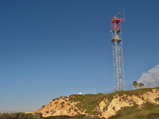 Modern antenna mast on Gale Beach in Albufeira, Algarve - Portugal