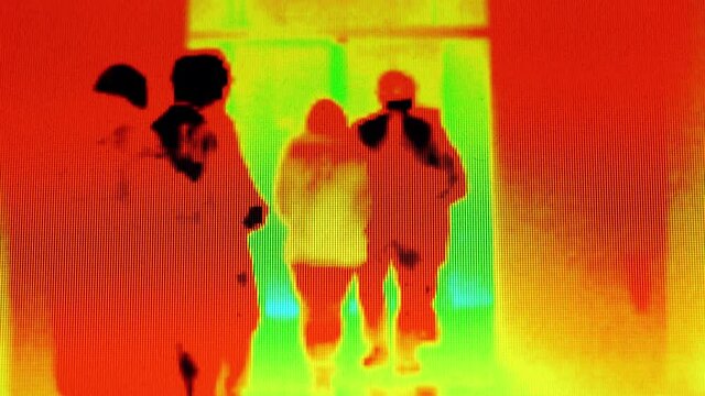 Passers-by are being shown through infrared radiation