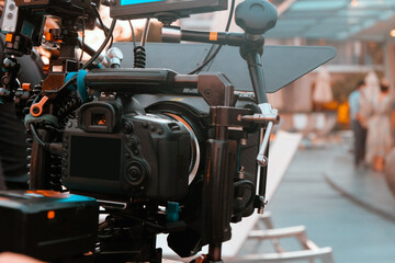 Fototapeta na wymiar Film industry. Filming with professional camera background