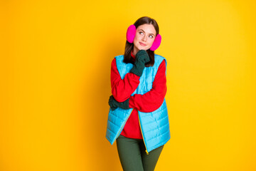 Photo minded interested girl touch green mittens chin look copyspace think thoughts decide winter holiday plans wear blue pink trousers sweater isolated bright shine color background