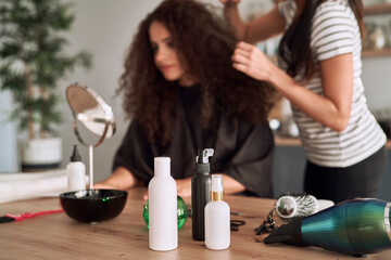 Hair dye cosmetics and women on the background