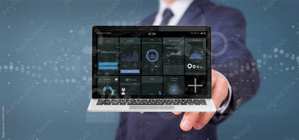 Aufkleber businessman holding laptop with business user interface data on the screen isolated on a background