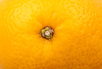 Close-up texture of orange skin. Full frame of an unpeeled orange.