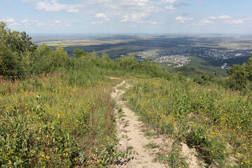 Fototapeta na wymiar Trail from Mount Tserkovka, Belokurikha town, Altai, Russia