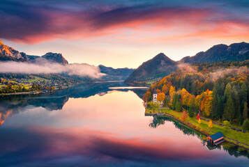 Stunning autumn view from flying drone of Grundlsee lake. Splendid morning scene of Eastern Alps,...