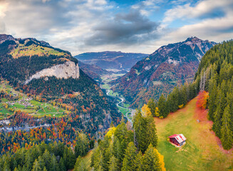 View from flying drone of Gsteigwiler village. Wonderful morning scene of Swiss Alps. Spectacular autumn landscape of Switzerland, Europe. Traveling concept background.