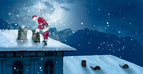 santa stands on a snowy roof and looks into the chimney
