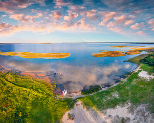 Unbelievable sunset on Svityaz lake. Wonderful evening scene of Shatsky National Park, Volyn region, Ukraine, Europe. Beauty of nature concept background.