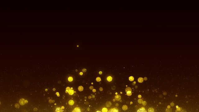 Golden particles background, shimmering glittering particles on bokeh background