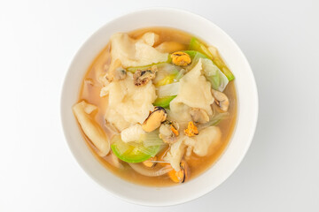 Seafood sujebi on a white background