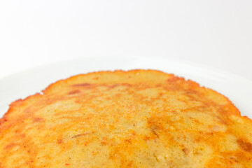 Pancakes with green beans on a white background