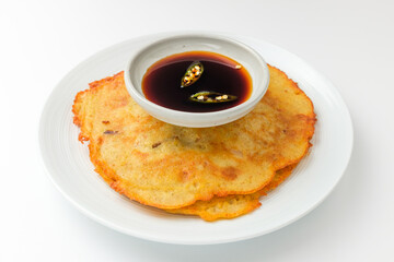 Pancakes with green beans on a white background