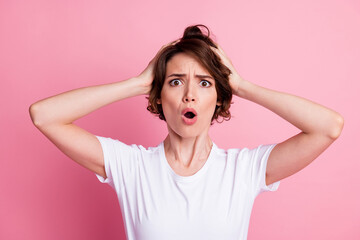 Close-up portrait of lovely messy puzzled nervous brown-haired girl bad news reaction pou lips isolated over pink color background