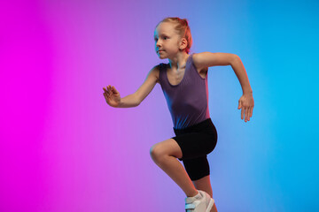 Profile. Teenage girl, professional runner, jogger in action, motion isolated on gradient pink-blue background in neon light. Concept of sport, movement, energy and dynamic, healthy lifestyle.