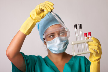 Young chemist student working in lab on chemicals