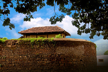A derelict old house on top of a hill