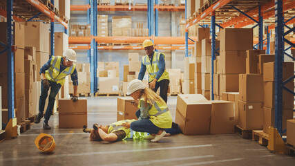 Warehouse Worker Has Work Related Accident Falls while Trying to Pick Up Cardboard Box from the...