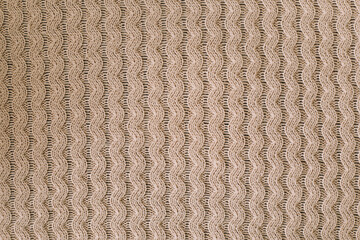 Knitting pattern of wool. Knitting. Texture of knitted woolen fabric for wallpaper and an abstract...
