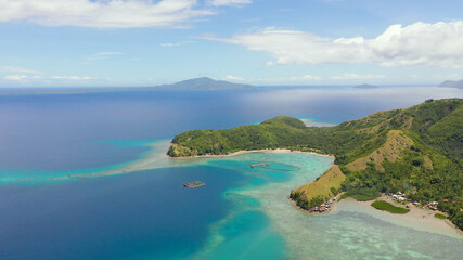 Fototapeta na wymiar Seascape with tropical islands and turquoise water. Sleeping dinosaur island located on the island of Mindanao, Philippines.