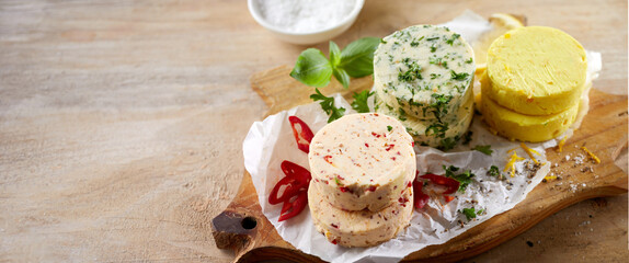 Round flavored butter pats with fresh ingredients