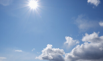 Obraz na płótnie Canvas Blue sky with clouds and sun.