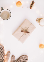 Christmas background. Gift box with decorations on white background. Christmas and New Year festive composition. Flatlay, top view