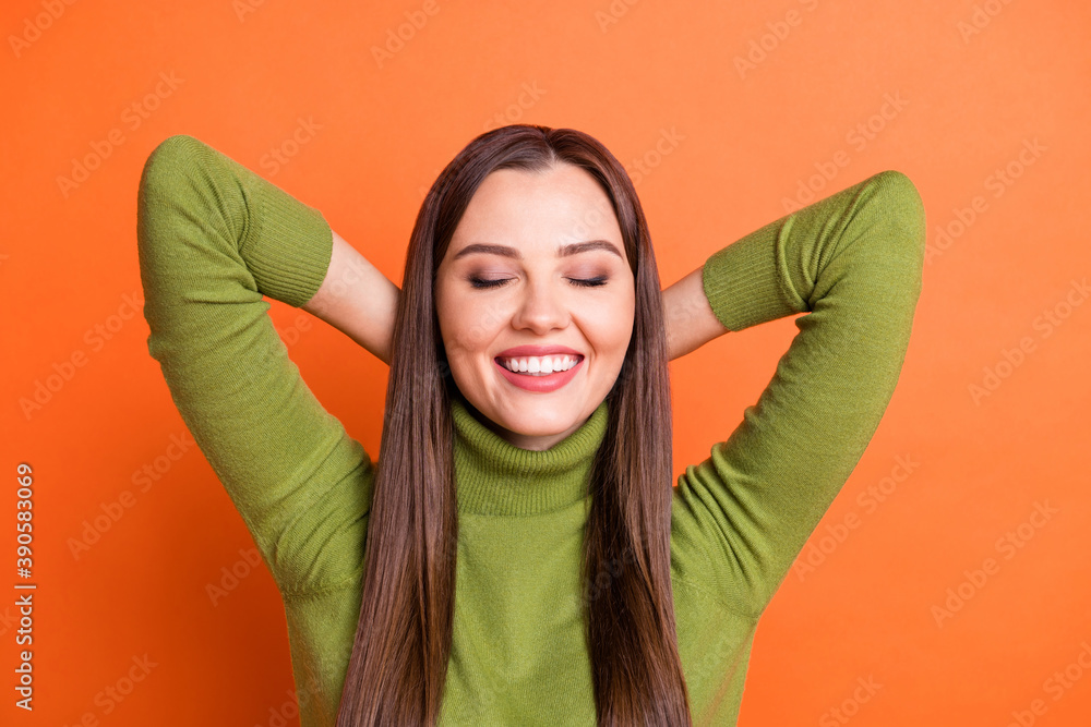 Sticker Top above high angle view photo of young beautiful smiling dreamy girl hold hands behind head isolated on orange color background