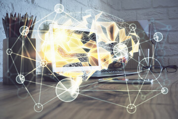Double exposure of desktop computer and human brain drawing hologram. Ai concept.