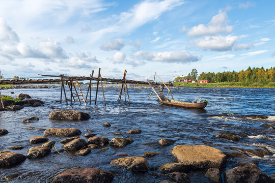 Bridge out to the rapid with a boat attached.